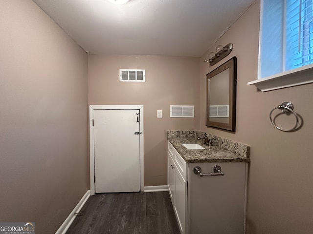 bathroom featuring hardwood / wood-style floors and vanity