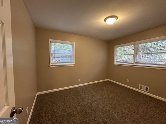4310 Bakers Ferry Rd SW, Atlanta, GA 30331 - spare room with healthy amount of natural light, baseboards, and dark carpet