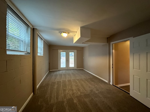 unfurnished room with french doors and carpet