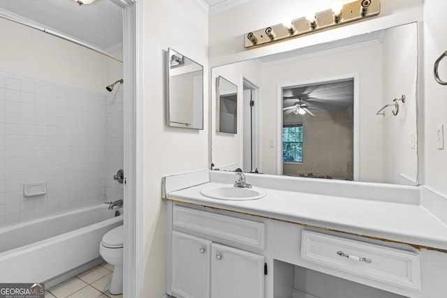 full bathroom with ceiling fan, tile patterned floors, toilet, vanity, and ornamental molding