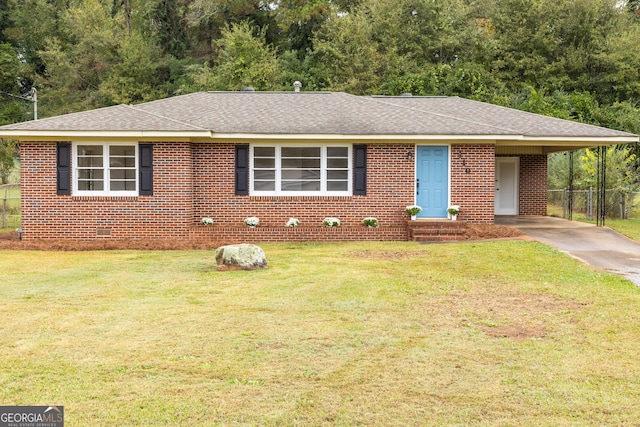 ranch-style home with a front yard and a carport