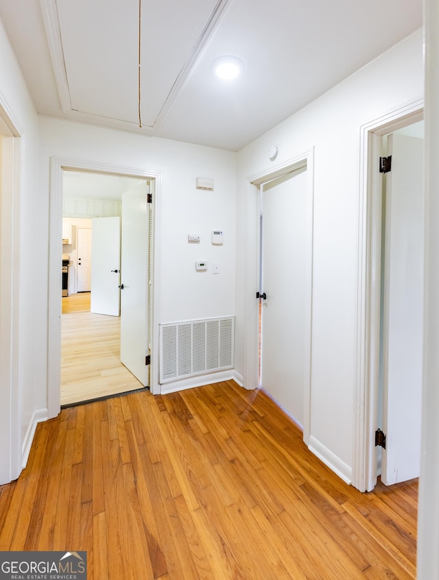 corridor with light wood-type flooring