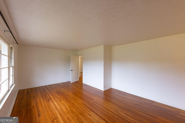 empty room featuring hardwood / wood-style flooring