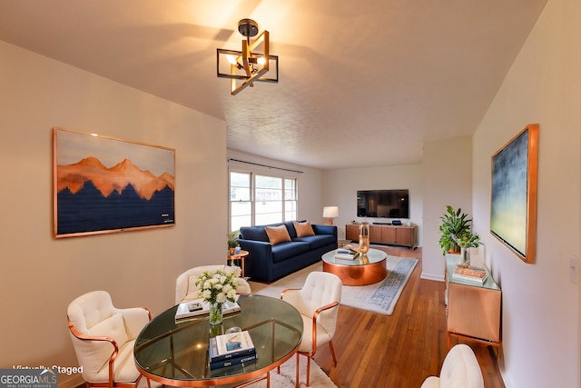 interior space featuring hardwood / wood-style floors and a notable chandelier