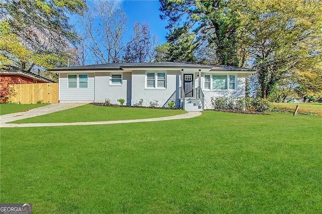 ranch-style home with a front yard