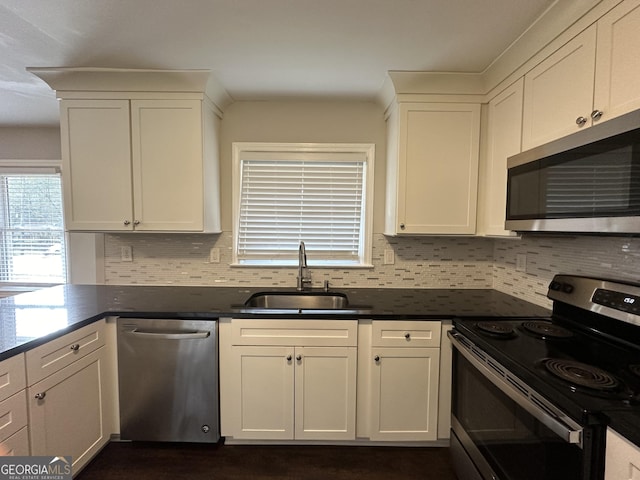3168 Mcafee Rd, Decatur, GA 30032 - kitchen featuring stainless steel appliances, a sink, backsplash, and dark countertops