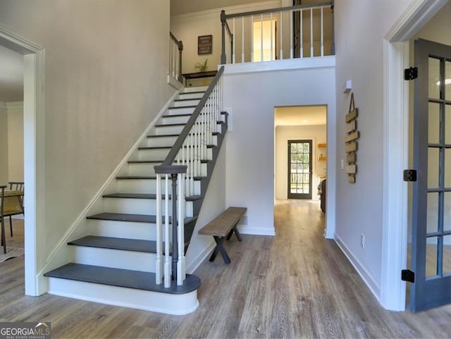 stairs with hardwood / wood-style flooring