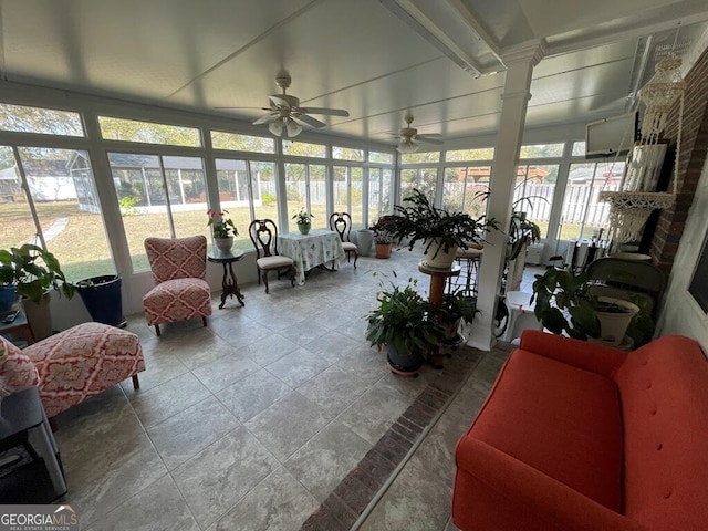 sunroom featuring a wealth of natural light and ceiling fan