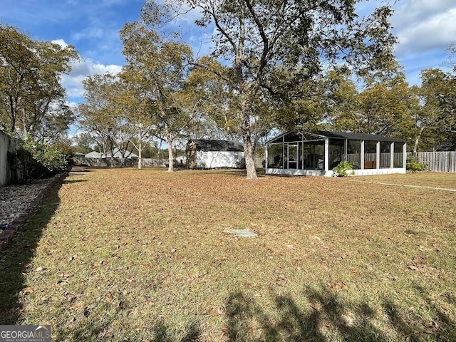 view of yard with a sunroom