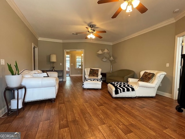 living room with ornamental molding, hardwood / wood-style floors, and ceiling fan