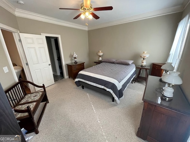 bedroom with ornamental molding, light colored carpet, and ceiling fan