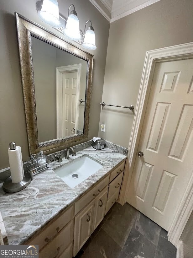 bathroom with vanity and ornamental molding