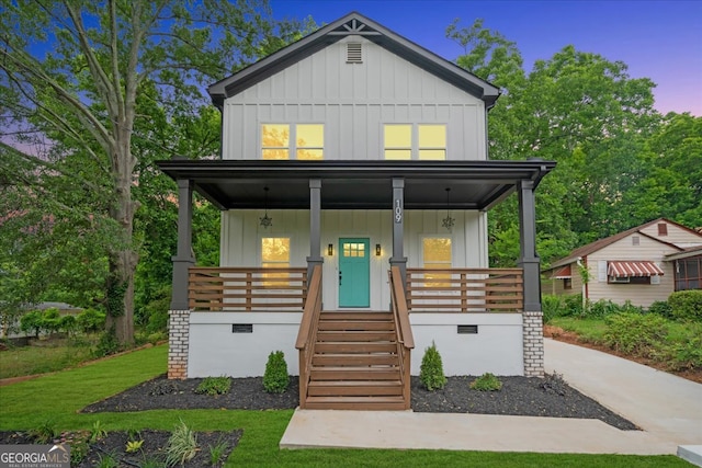 view of front facade featuring a yard and covered porch