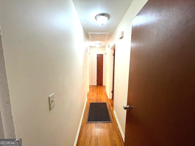 hall with light hardwood / wood-style flooring