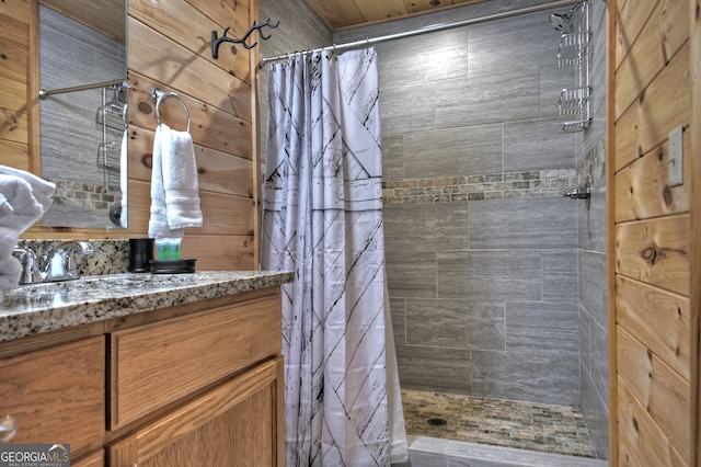 bathroom featuring vanity, tasteful backsplash, and a shower with curtain