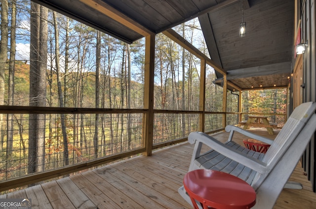 sunroom / solarium with wooden ceiling and lofted ceiling