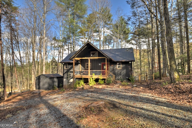 view of front of property with a storage shed