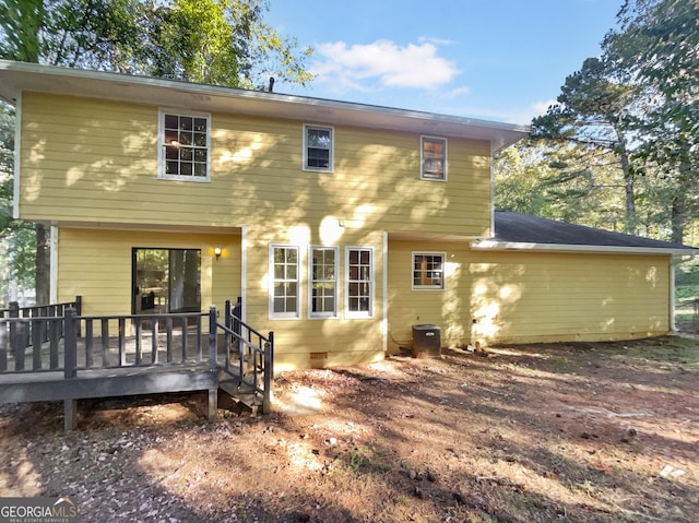 rear view of property with a wooden deck