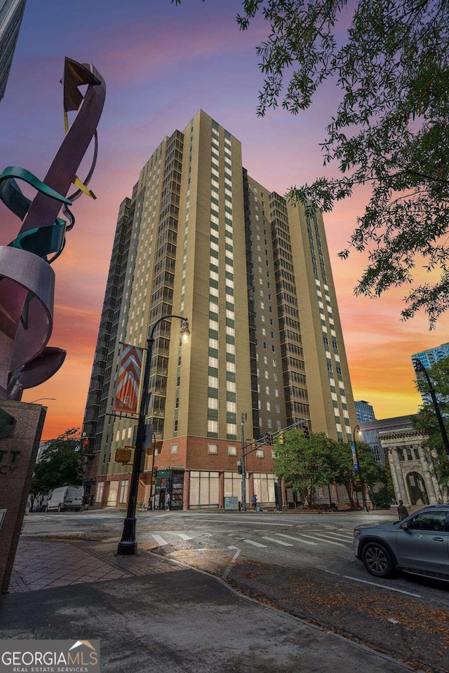 view of outdoor building at dusk