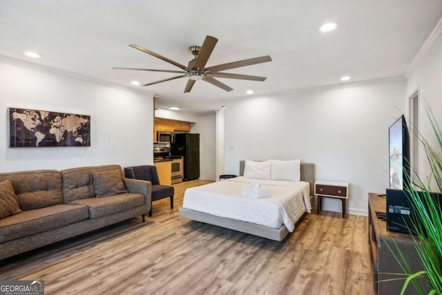 bedroom featuring light hardwood / wood-style floors, ceiling fan, black fridge, and ornamental molding