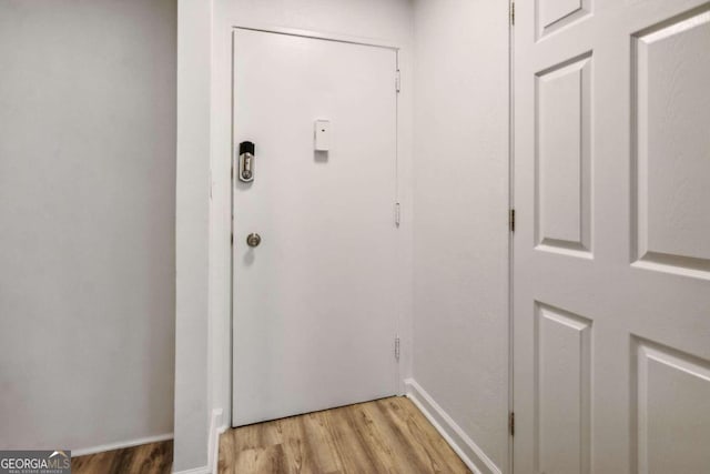 doorway to outside with light wood-type flooring