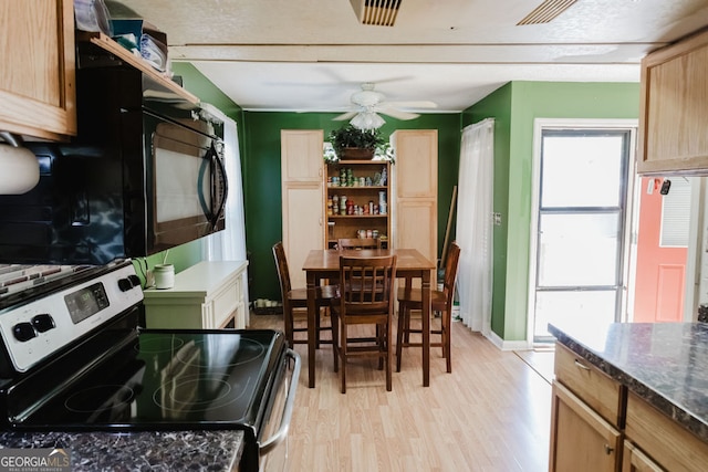 kitchen featuring ceiling fan, light hardwood / wood-style floors, electric stove, and light brown cabinetry