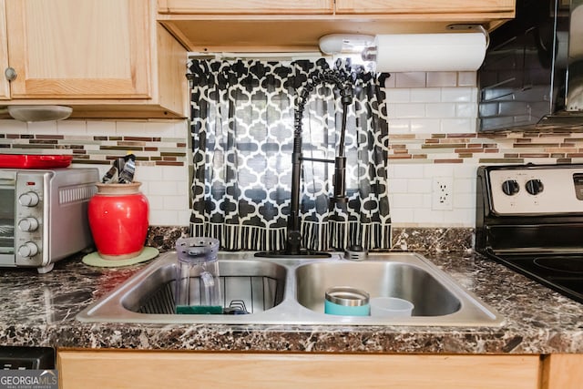 kitchen featuring backsplash, light brown cabinets, and range