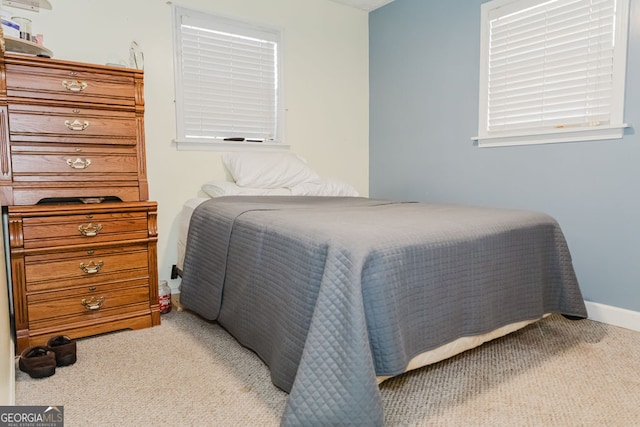 bedroom with light carpet