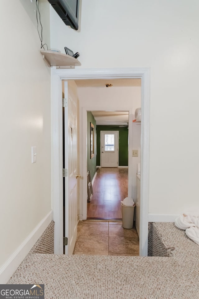 hallway with wood-type flooring