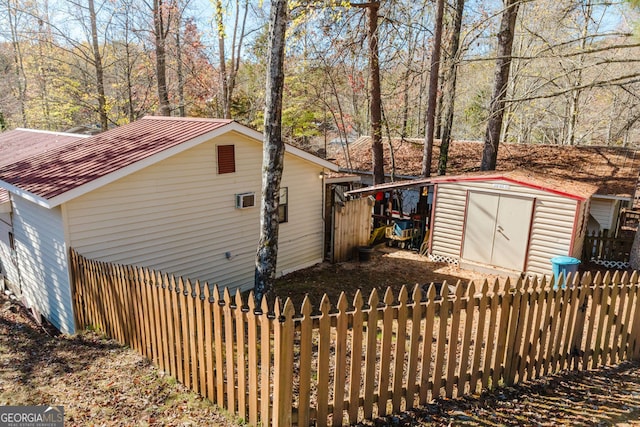 view of home's exterior with a shed