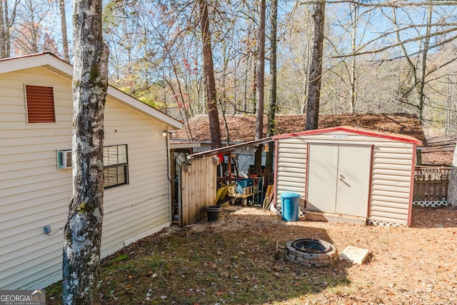 view of outdoor structure featuring a fire pit