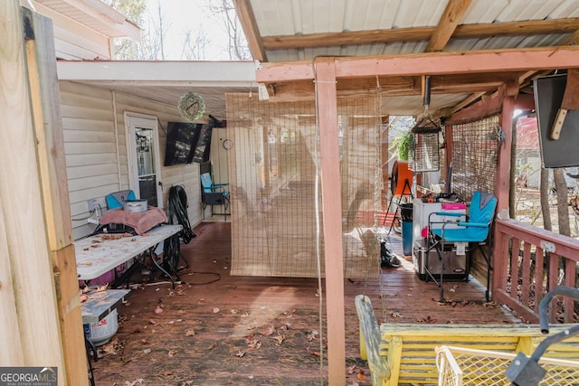 exterior space featuring a wealth of natural light and dark hardwood / wood-style flooring