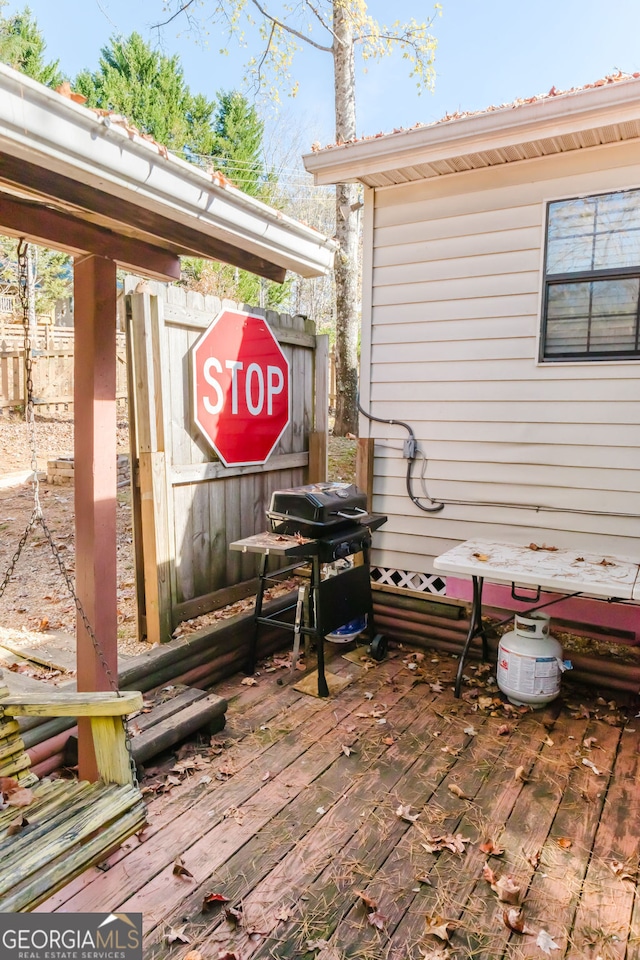 deck featuring a grill