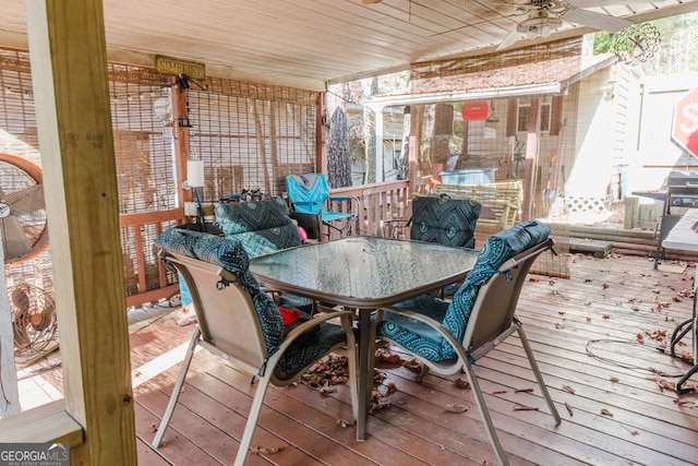 wooden deck featuring ceiling fan