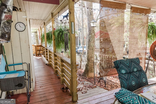 wooden terrace featuring a porch