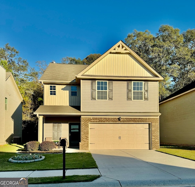 view of front of property with a garage and a front yard