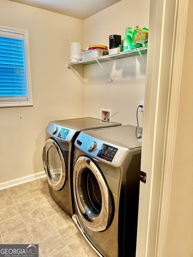 laundry room featuring washing machine and clothes dryer