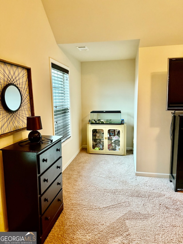 living area with light colored carpet