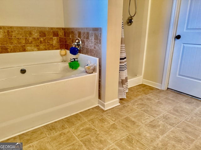 bathroom featuring shower with separate bathtub