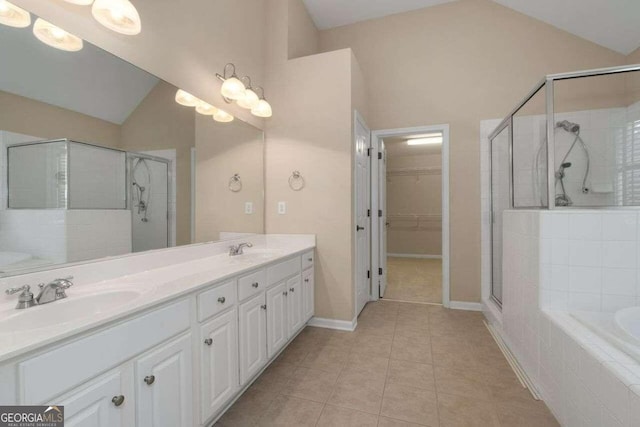 bathroom featuring high vaulted ceiling, vanity, tile patterned floors, and plus walk in shower