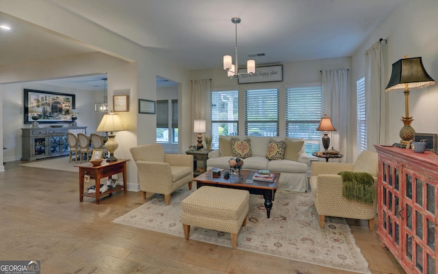 living room with a notable chandelier