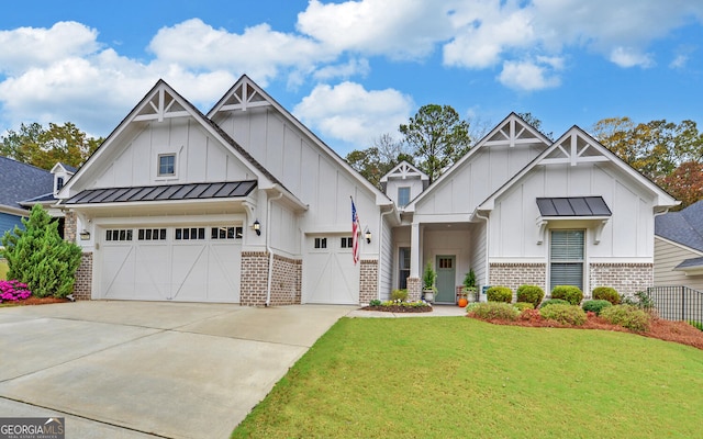 view of front of property featuring a garage and a front lawn