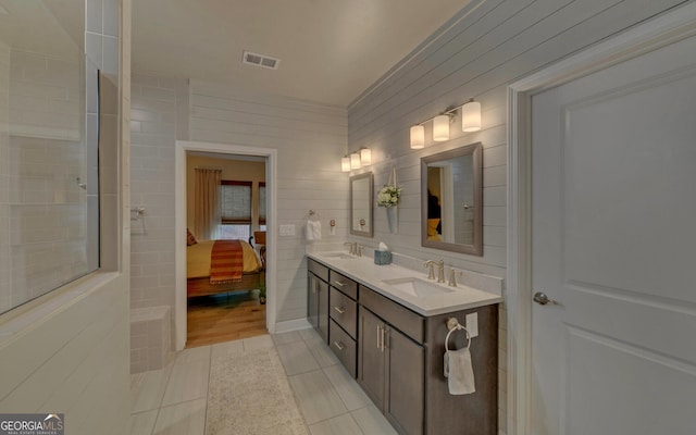 bathroom featuring tile walls, vanity, and tile patterned floors