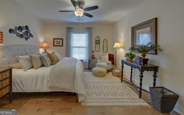 bedroom featuring hardwood / wood-style floors and ceiling fan