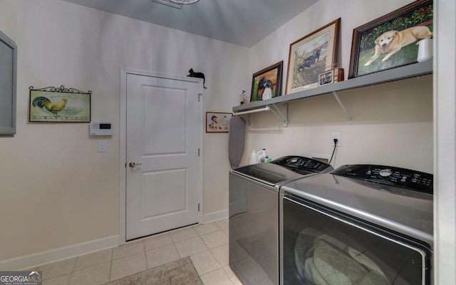 clothes washing area featuring separate washer and dryer and light tile patterned floors