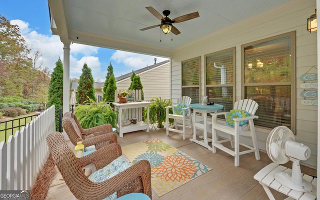 exterior space featuring ceiling fan and a porch