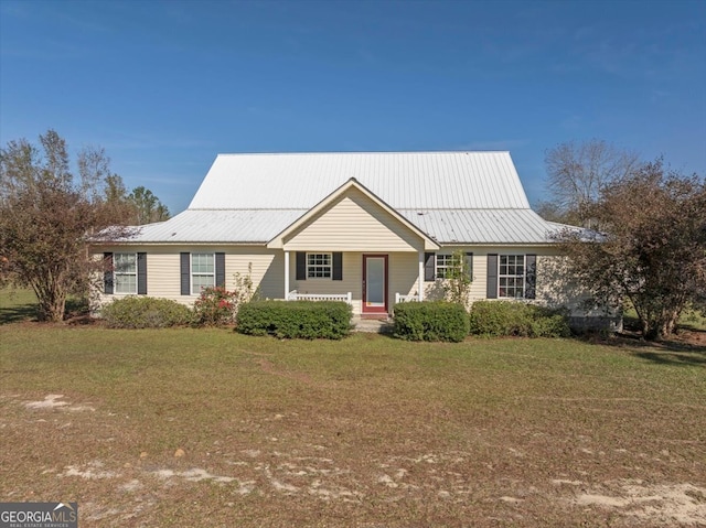 view of front of house with a front yard and covered porch