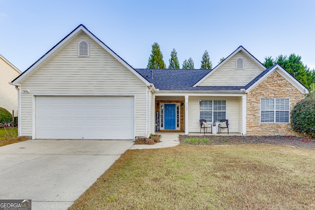 ranch-style house featuring a garage and a front yard