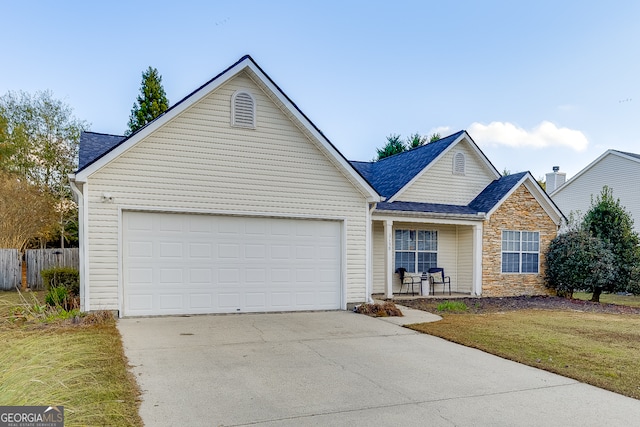 view of front facade with a garage and a front yard