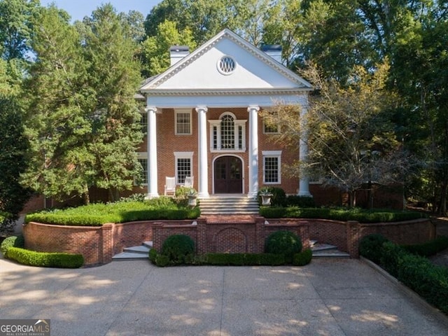 neoclassical home featuring french doors